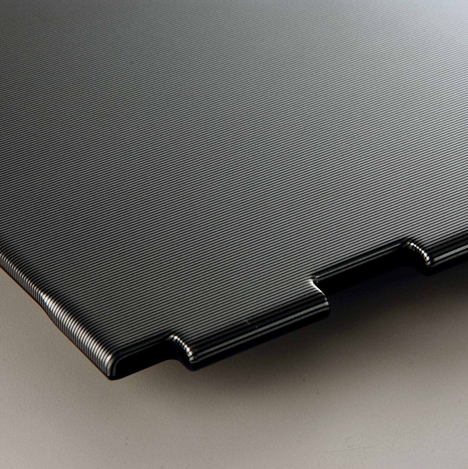 Laptop case decorated with dark plain laminated metal plate